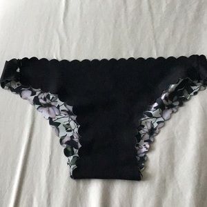 Reversible black or floral bikini bottom